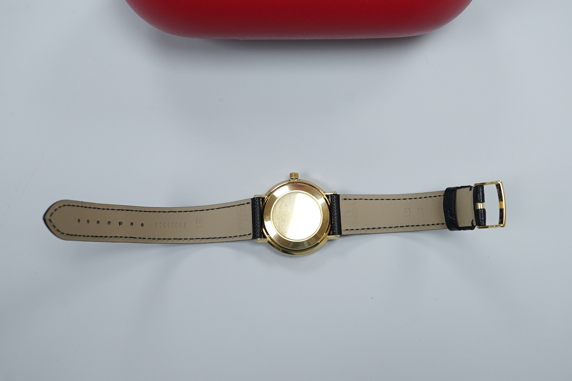 A gentleman's gold plated Omega De Ville automatic wrist watch, with baton numerals and date aperture, case diameter 35mm, on an associated strap, with Omega case.